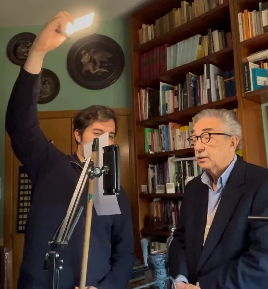 Federico filming his father, a neuropsychiatrist, in his study.